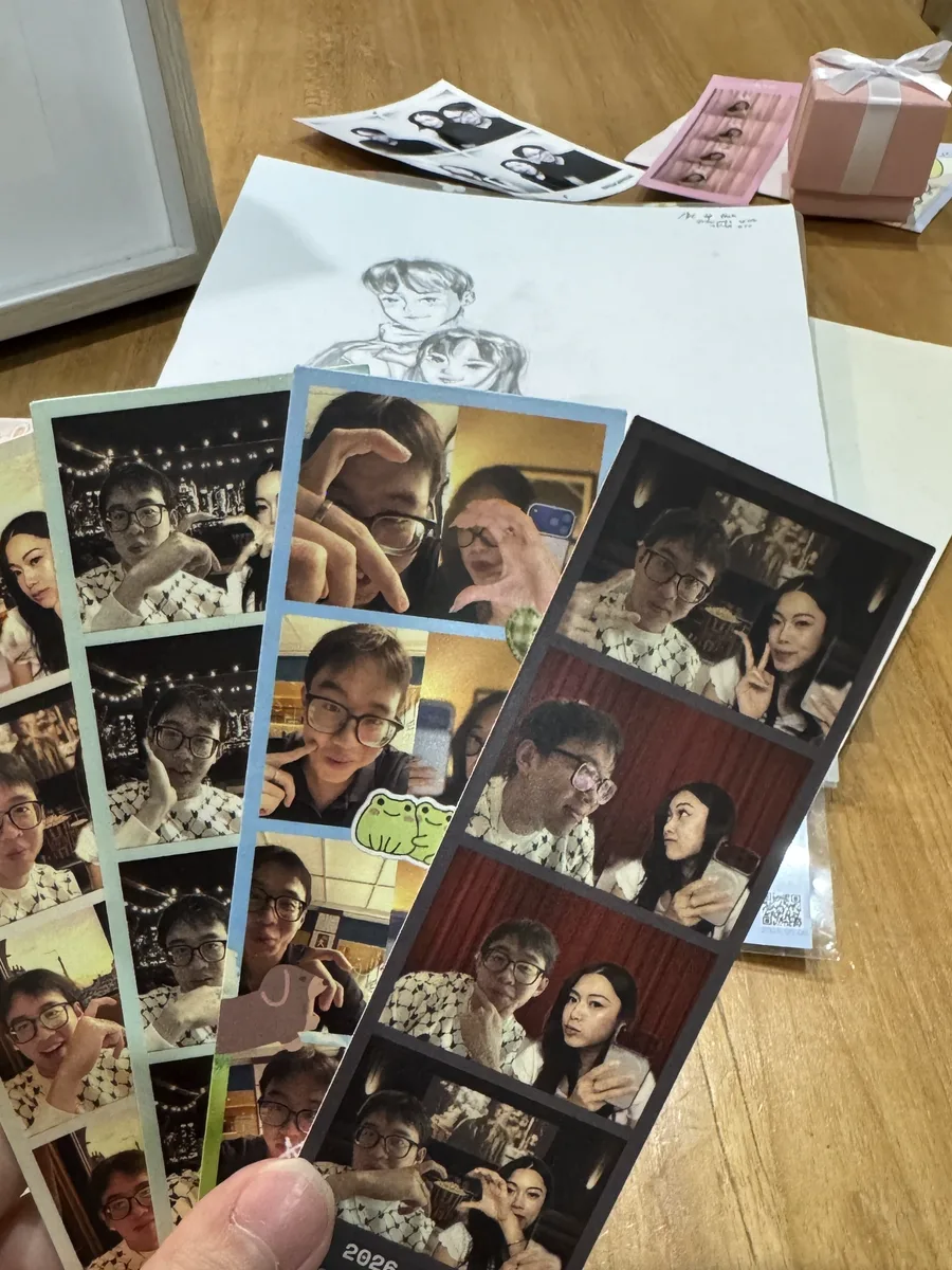 Printed photobooth strips lying on a desk.